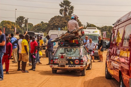 Motorbike on roof of a small Fiesta Fiesta in Africa carrying a motorbike on the roof