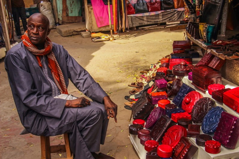 Vendor at his stall in the Dakar market - Overlanding in Africa