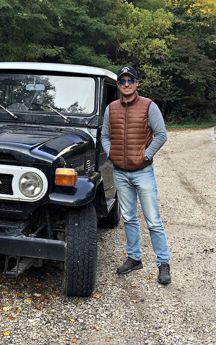 Ferenc Elekes beside his Toyota Land Cruiser FJ40