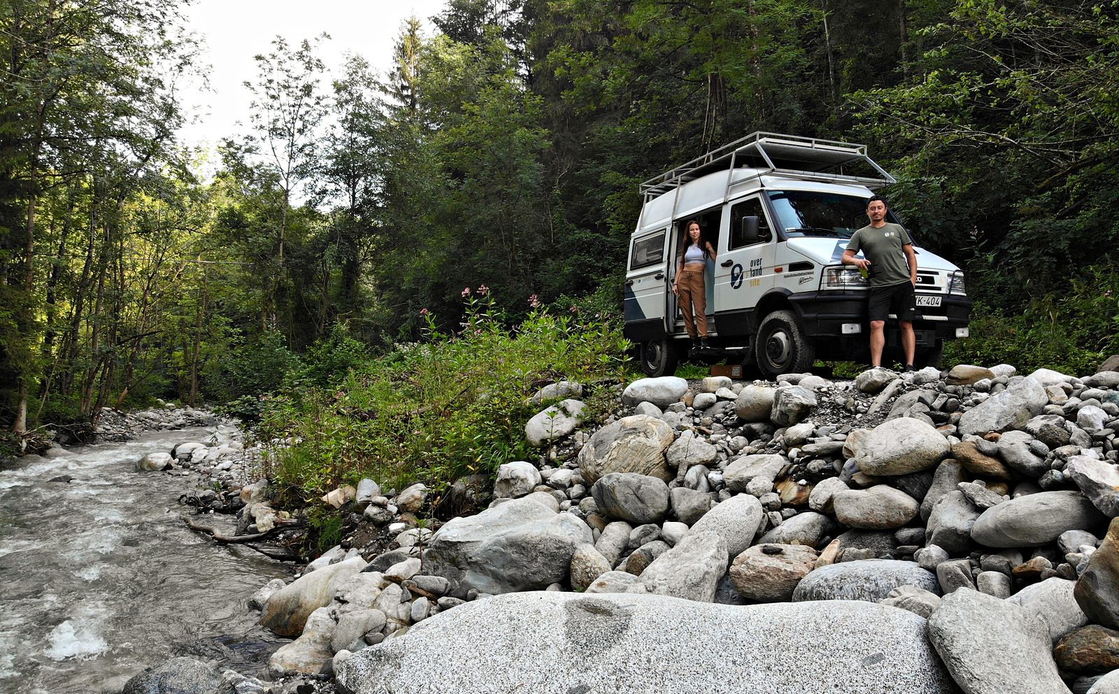 Ferenc and Evelin with their Iveco Turbodaily 4x4 camped beside a river